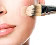 Makeup artist applying liquid tonal foundation on the face
