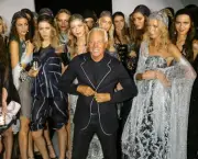 Giorgio Armani joins models on stage at the finale of his show.